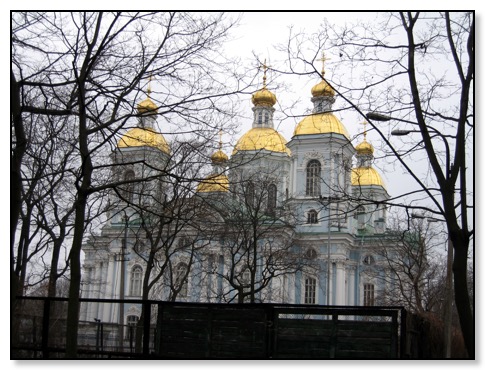 gold church through trees